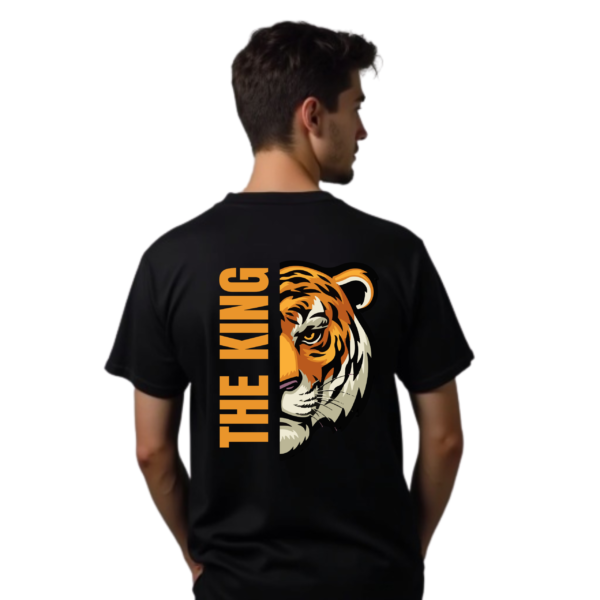 Black oversized t-shirt with a bold lion print design on the front, showcasing a fierce and majestic lion's face, symbolizing strength and power. The t-shirt is displayed against a neutral background, emphasizing its relaxed fit and striking graphic.