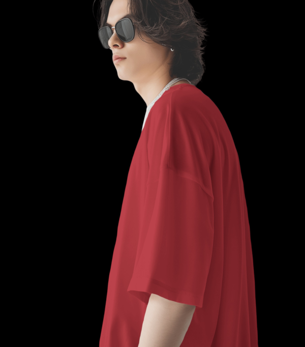 A boy wearing wine oversized T-shirt